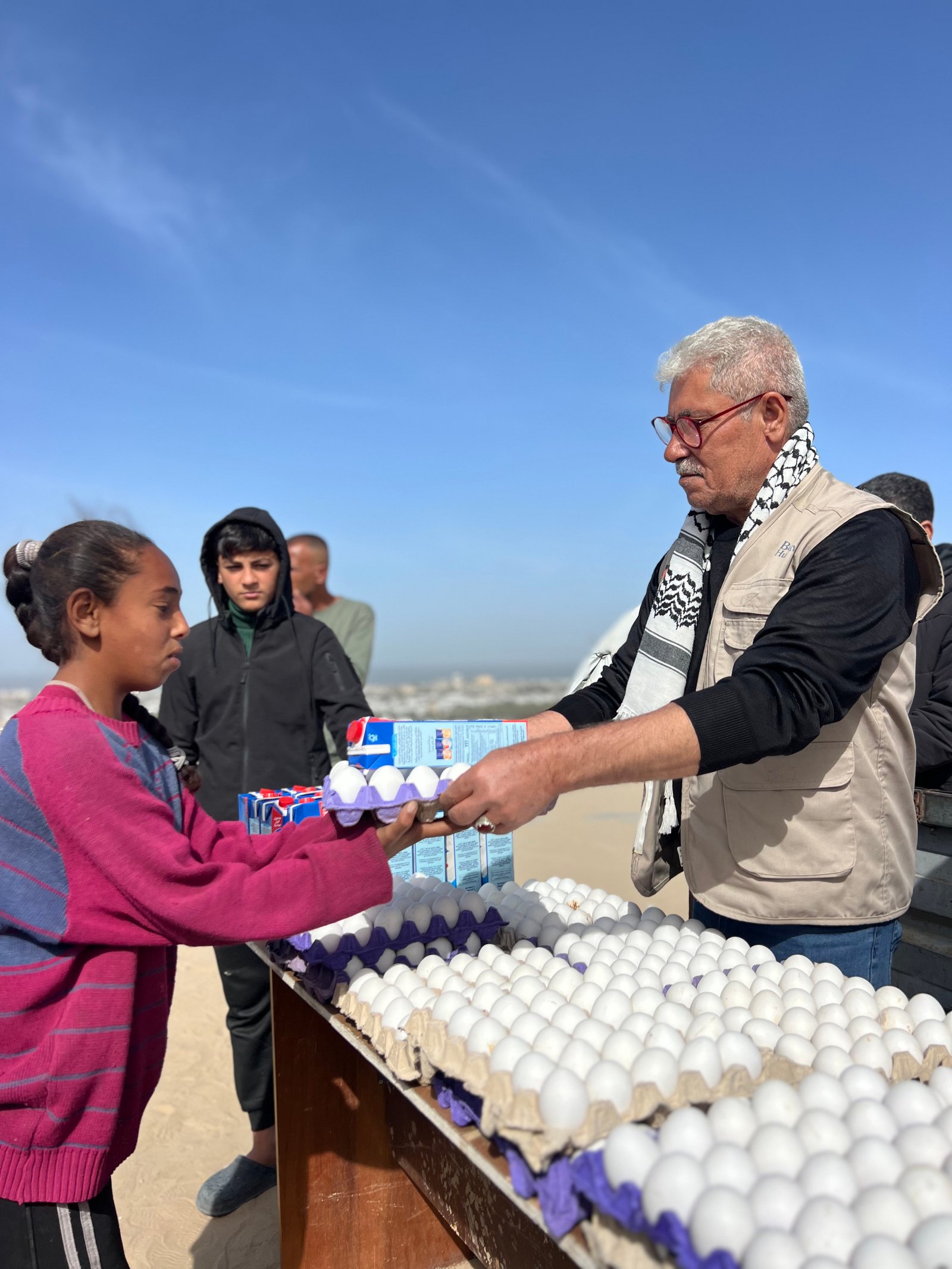 Distribution Egg and Fresh Milk for Displaced Families in Khan Younis Camps image 4