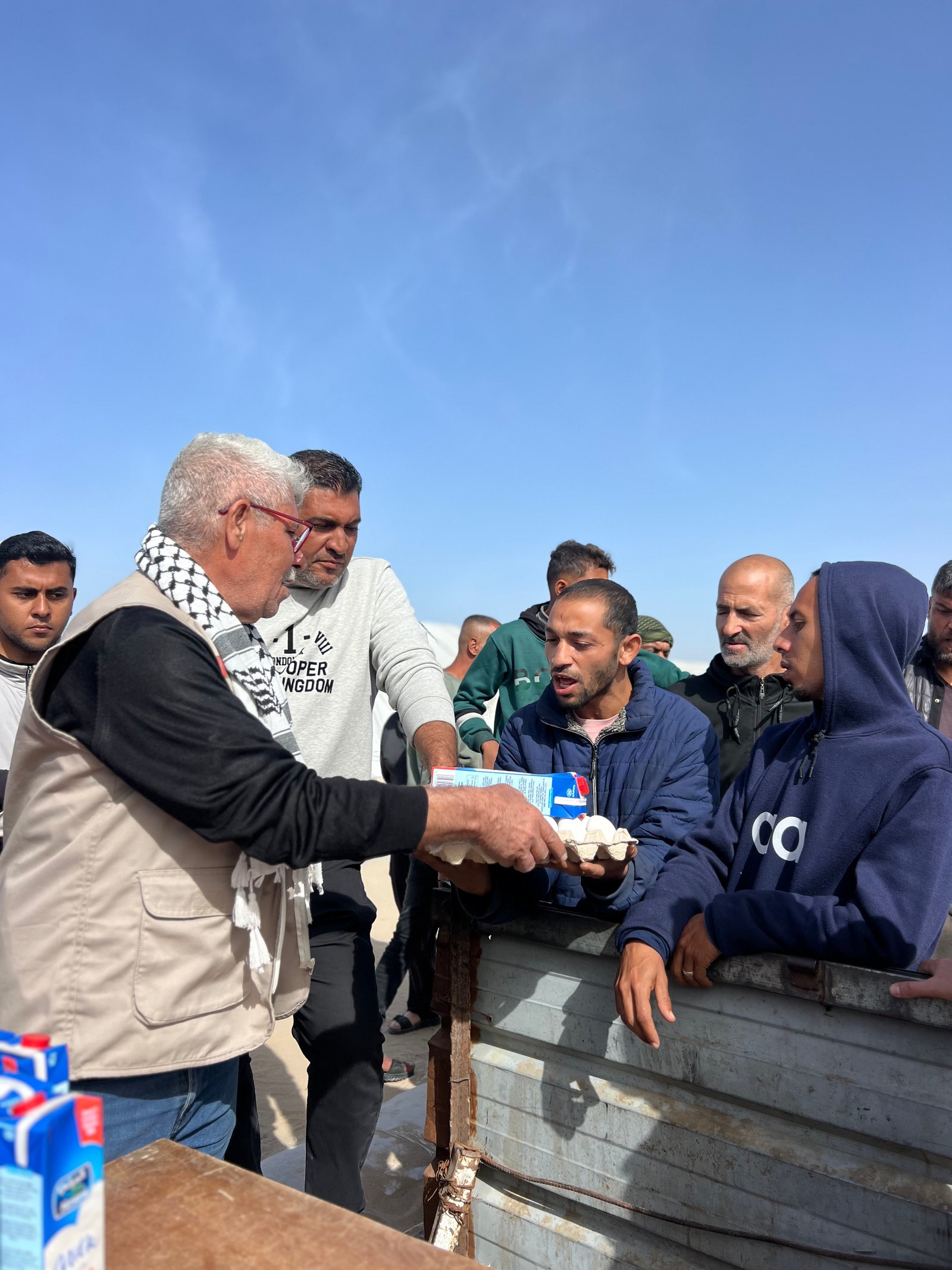 Distribution Egg and Fresh Milk for Displaced Families in Khan Younis Camps image 7