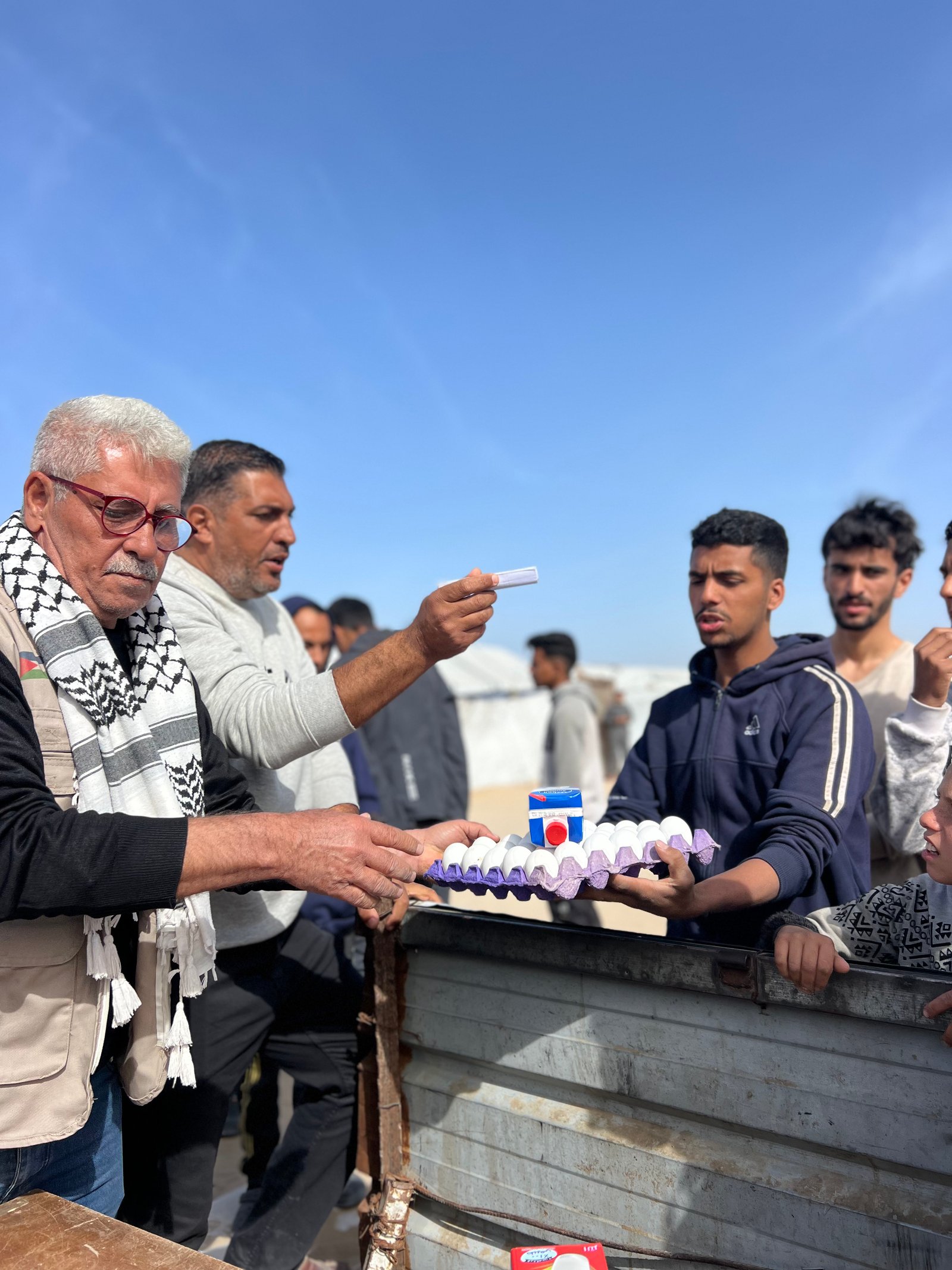 Distribution Egg and Fresh Milk for Displaced Families in Khan Younis Camps image 8